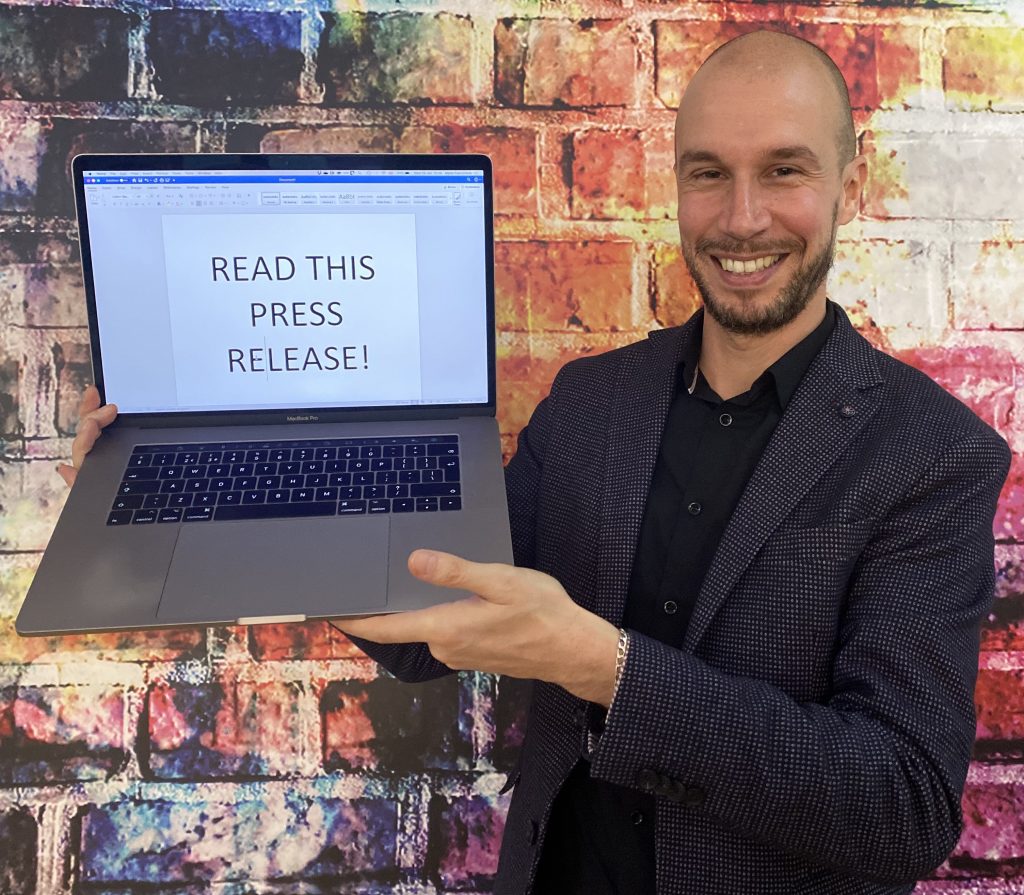 man holding laptop