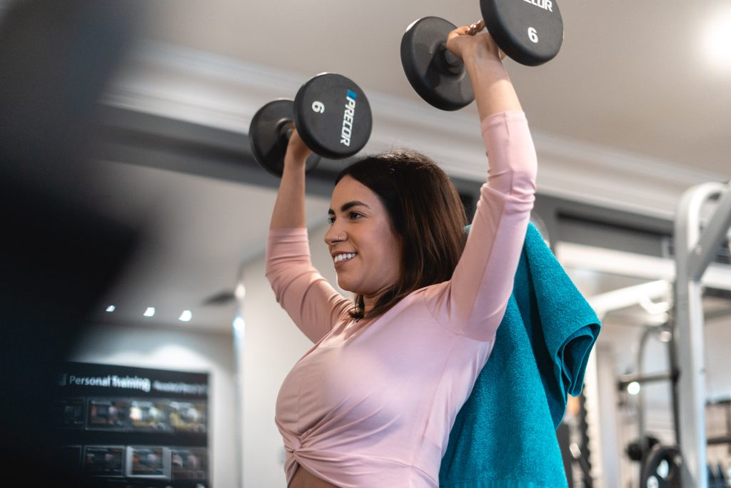 Woman lifting dumbbells