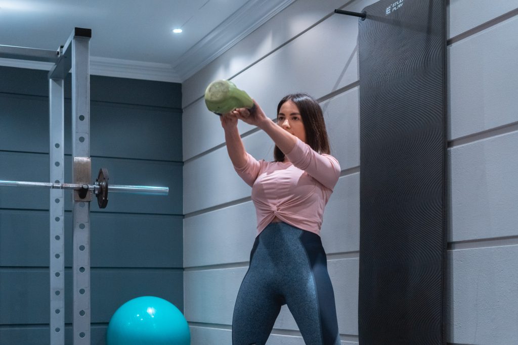 Woman using kettlebell