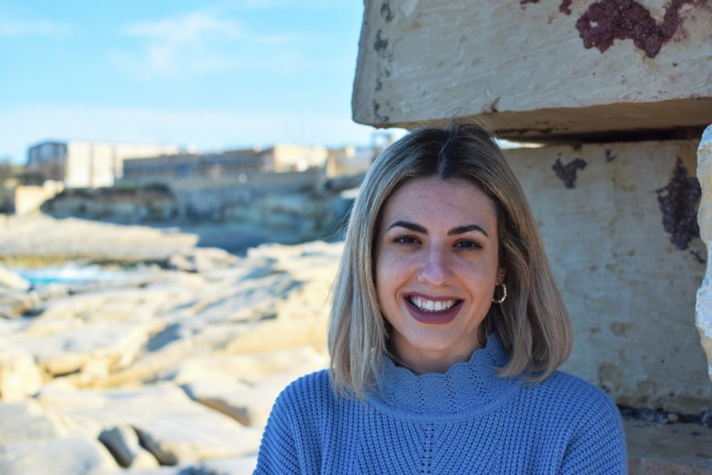 A woman smiling at the camera