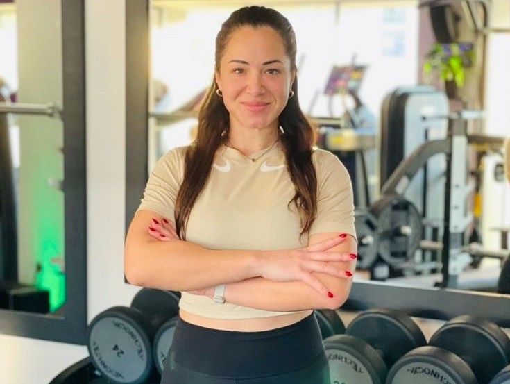 A woman standing in a gym