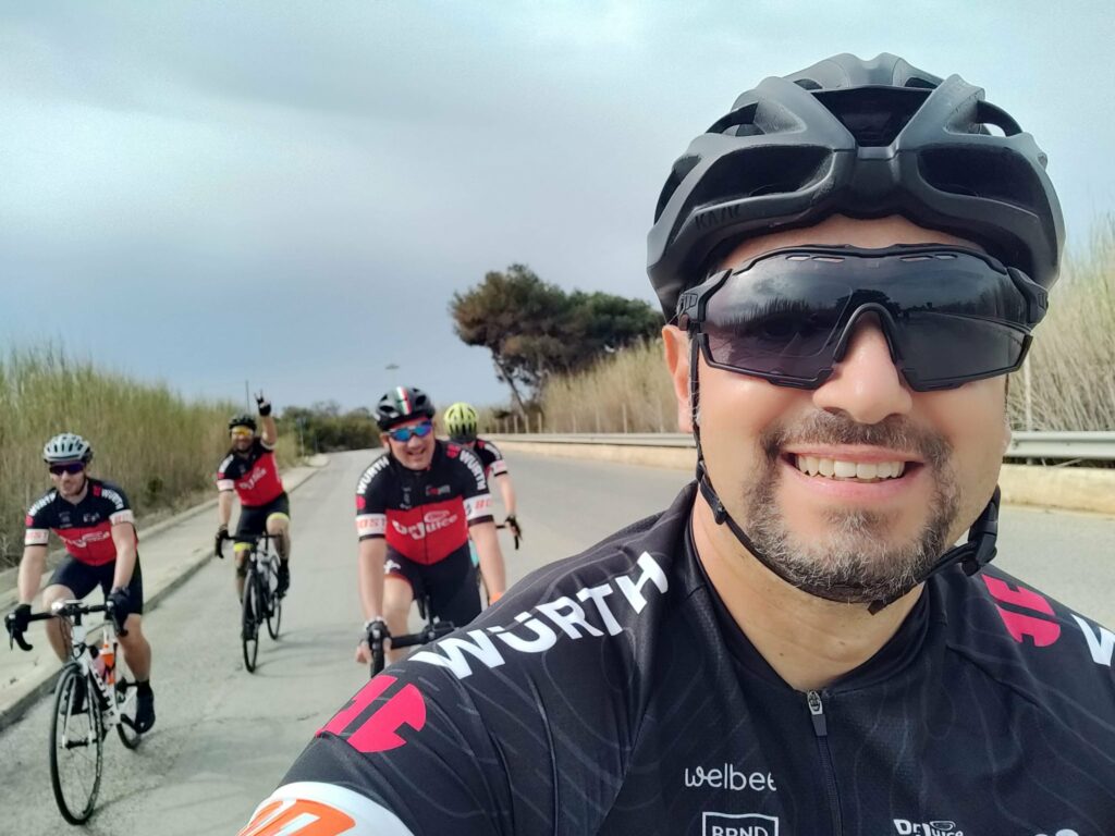 Cyclists with bikes smiling